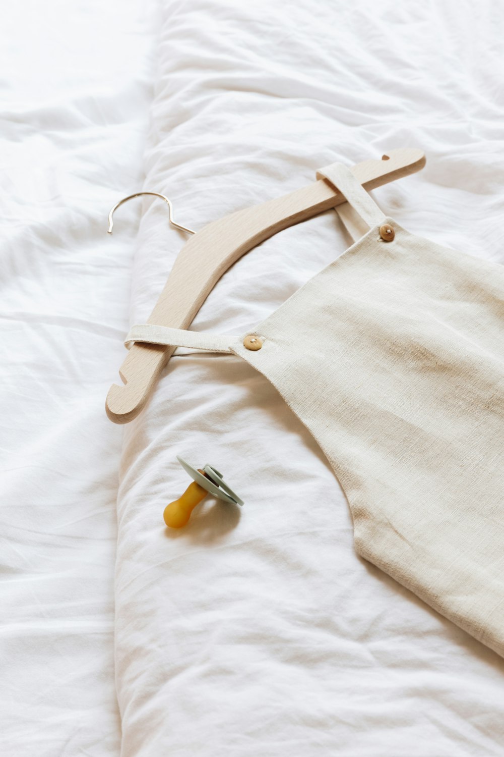 a pair of scissors and a piece of cloth on a bed