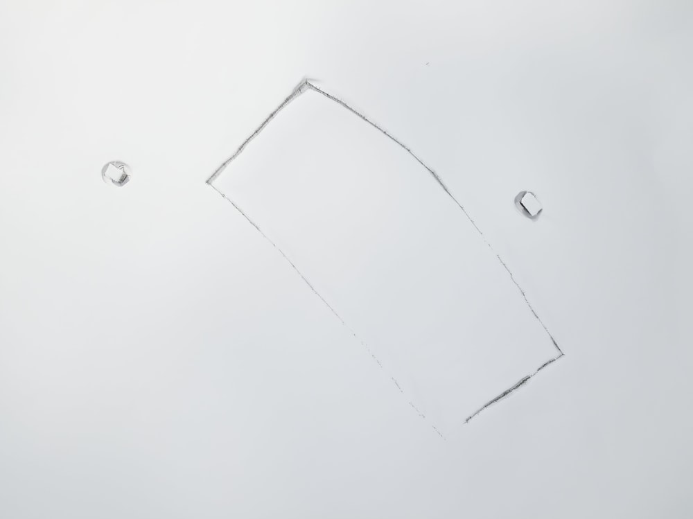 a drawing of a rectangular object with drops of water on it
