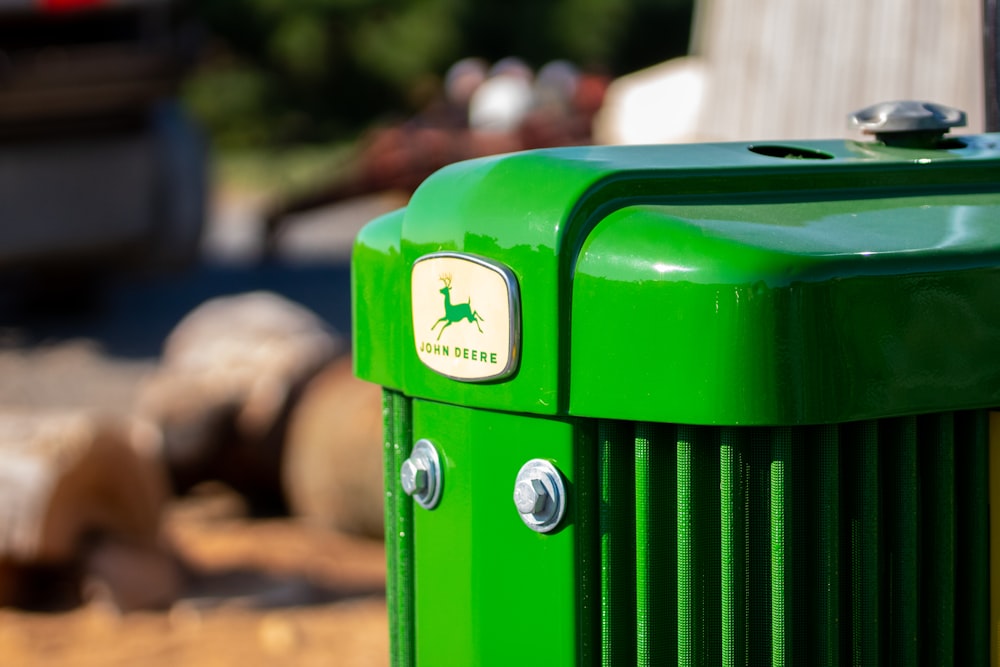 a close up of a green trash can
