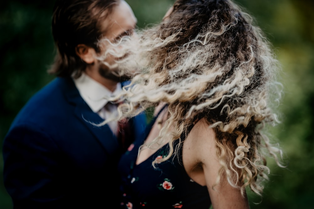 a man and a woman with long hair