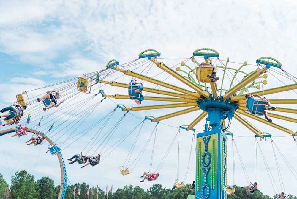 a carnival ride with people riding on it