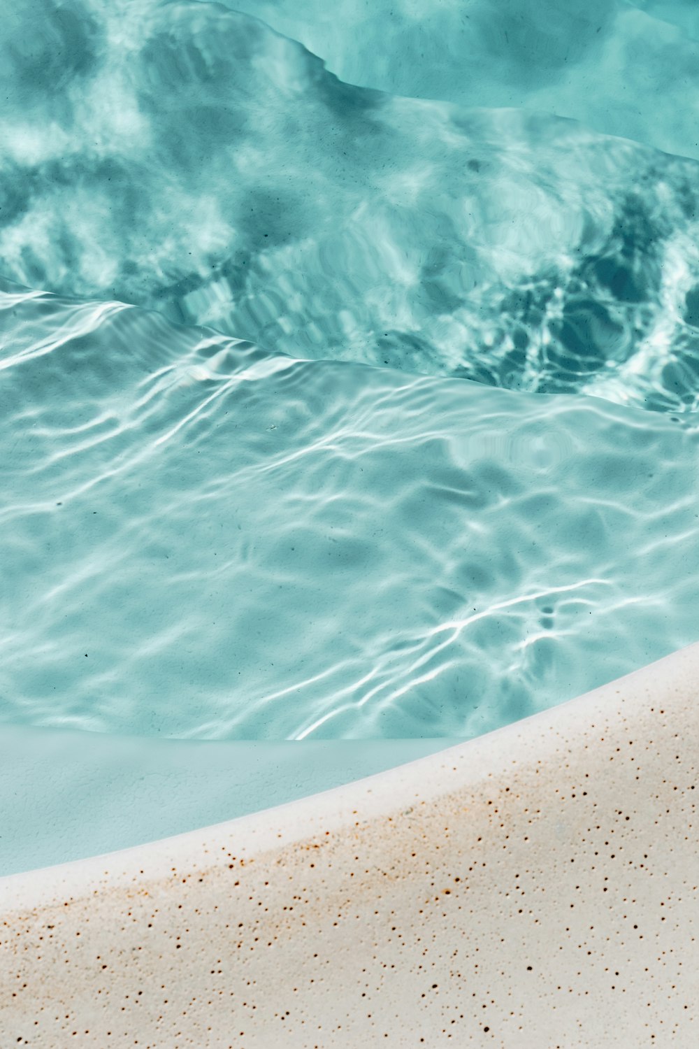 a close up of a surfboard in the water