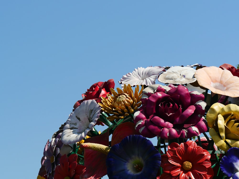 a bunch of flowers that are in the air