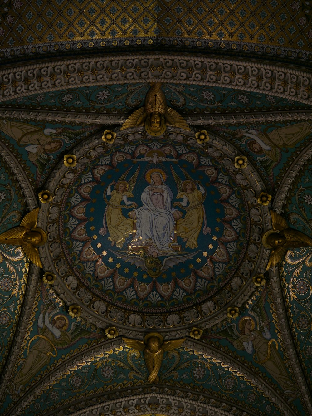 the ceiling of a building with a painting on it