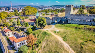 an aerial view of a city with a castle