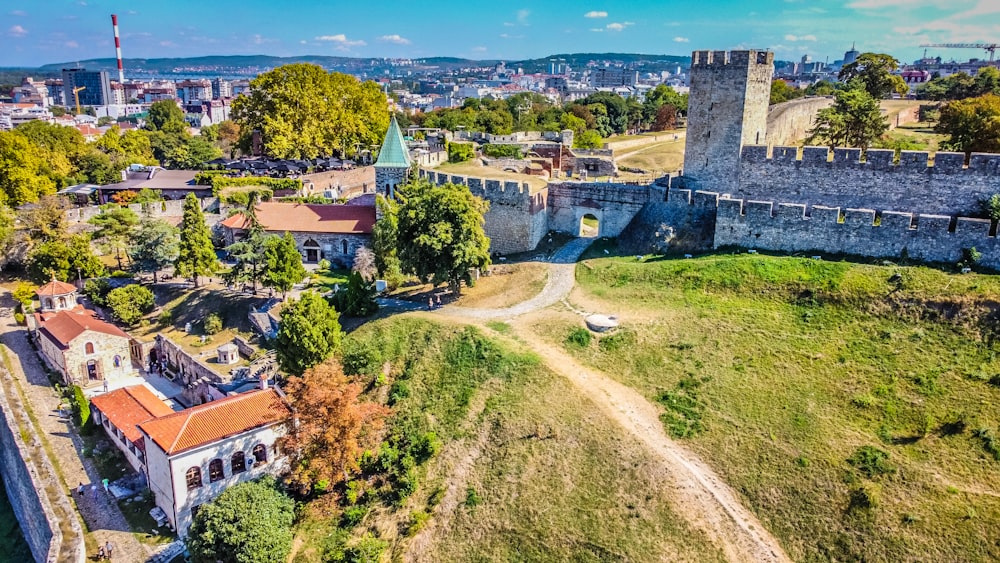 an aerial view of a city with a castle