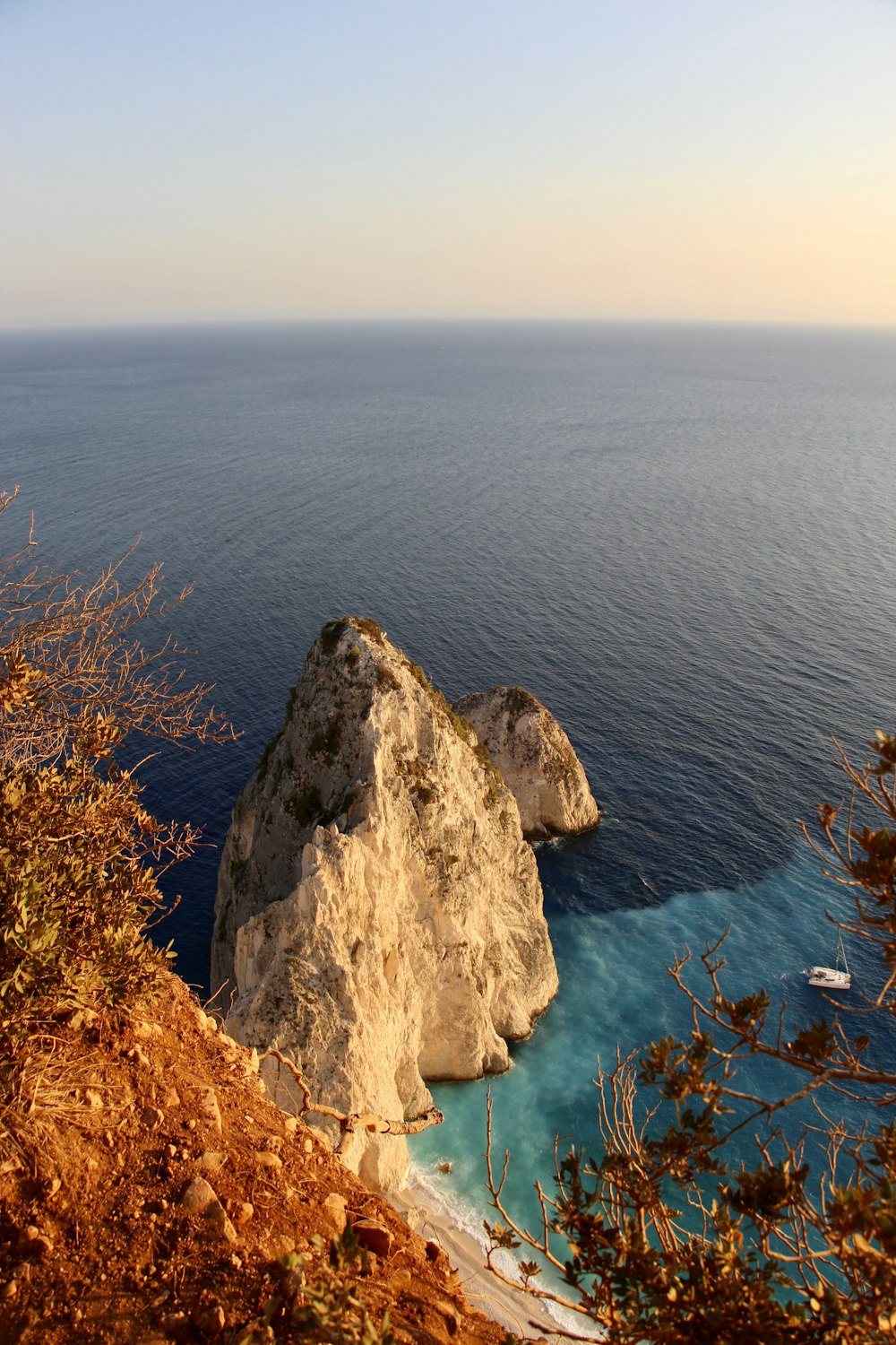 a rocky outcropping next to a body of water