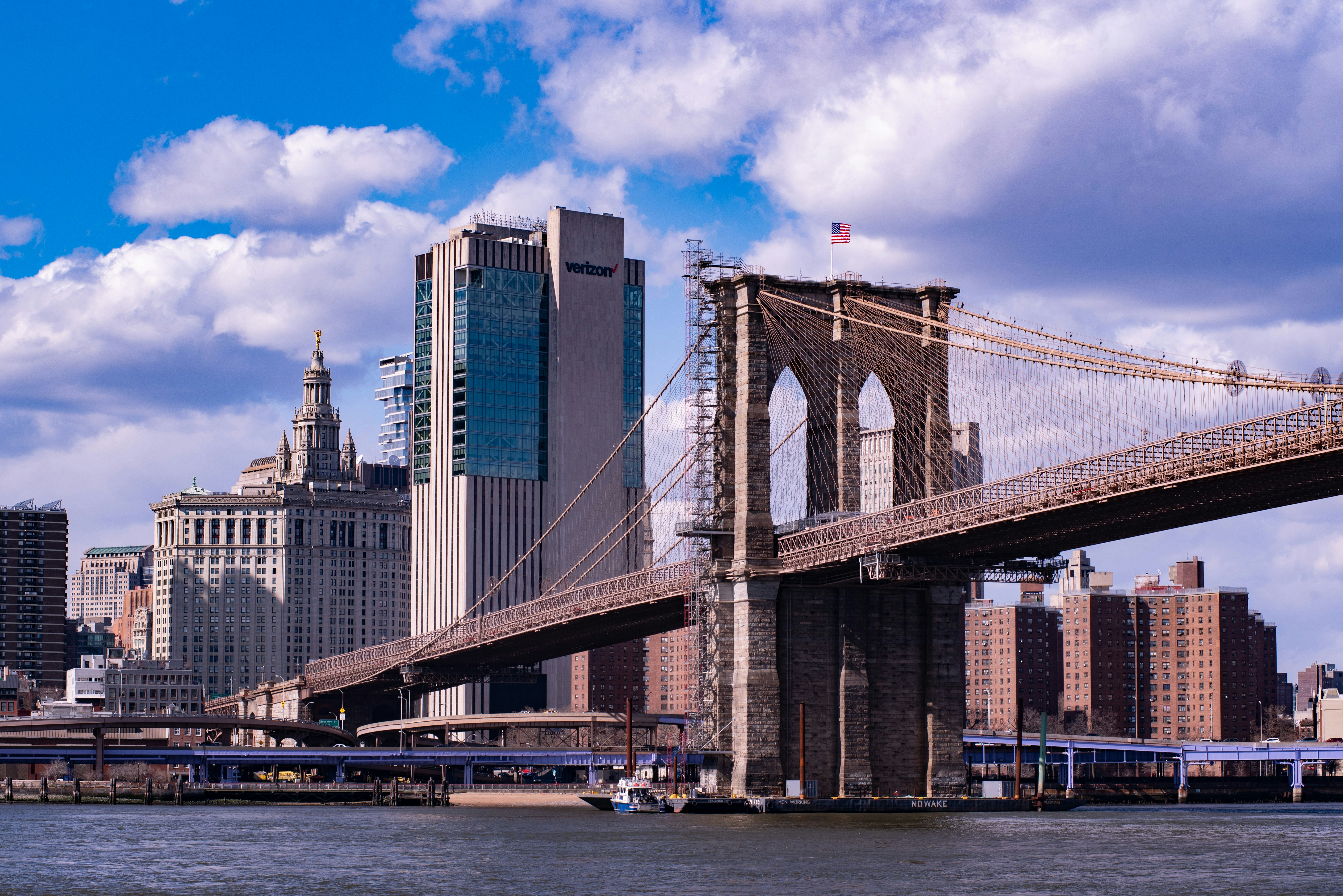 a view of the brooklyn bridge from across the river