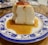 A happy customer enjoying a delicious pudding dessert.