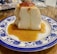 A happy customer enjoying a delicious pudding dessert.