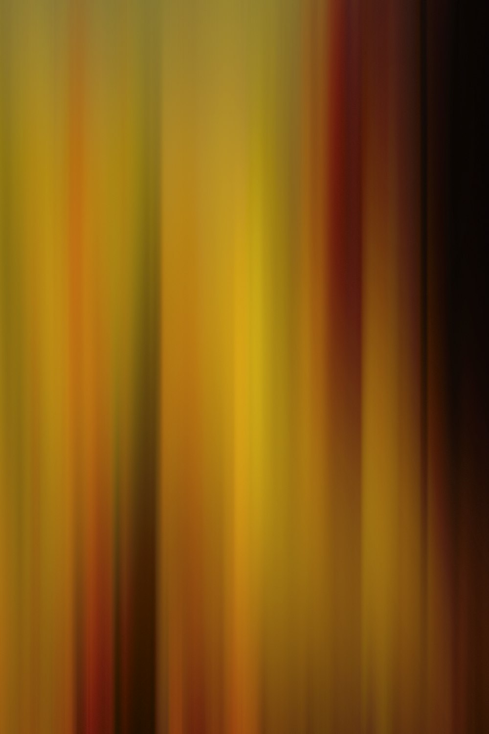 a blurry image of a yellow and red background