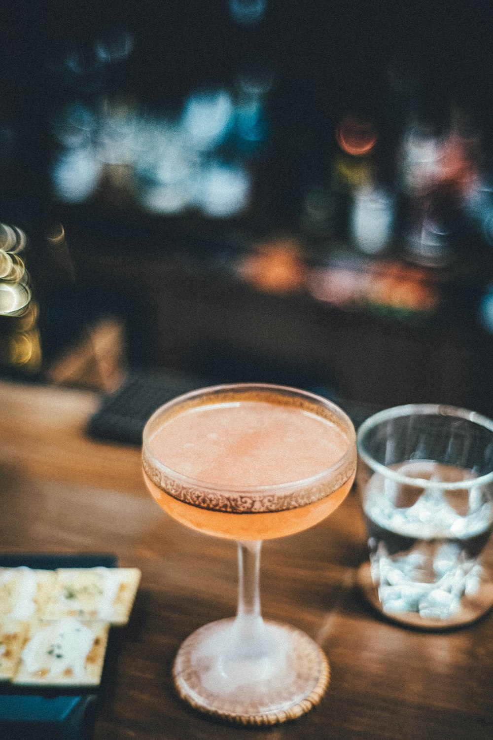 a close up of a wine glass on a table