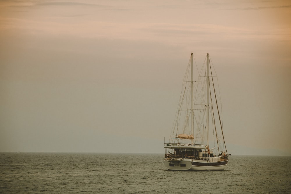 a sailboat in the middle of the ocean