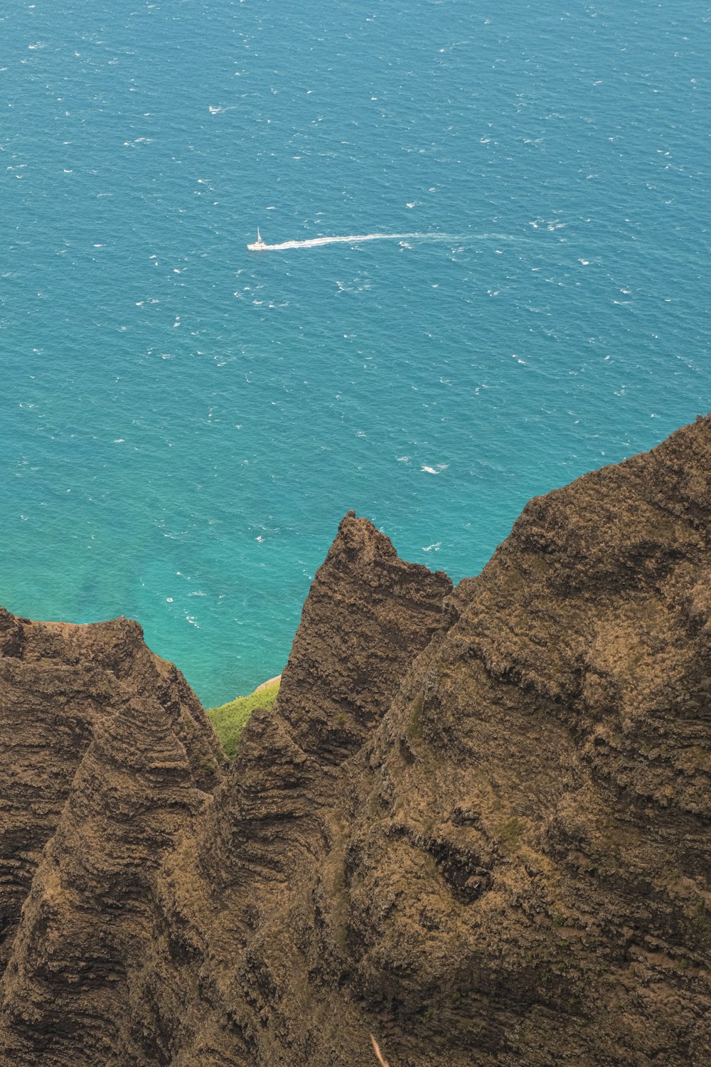 a boat is out in the ocean on a sunny day