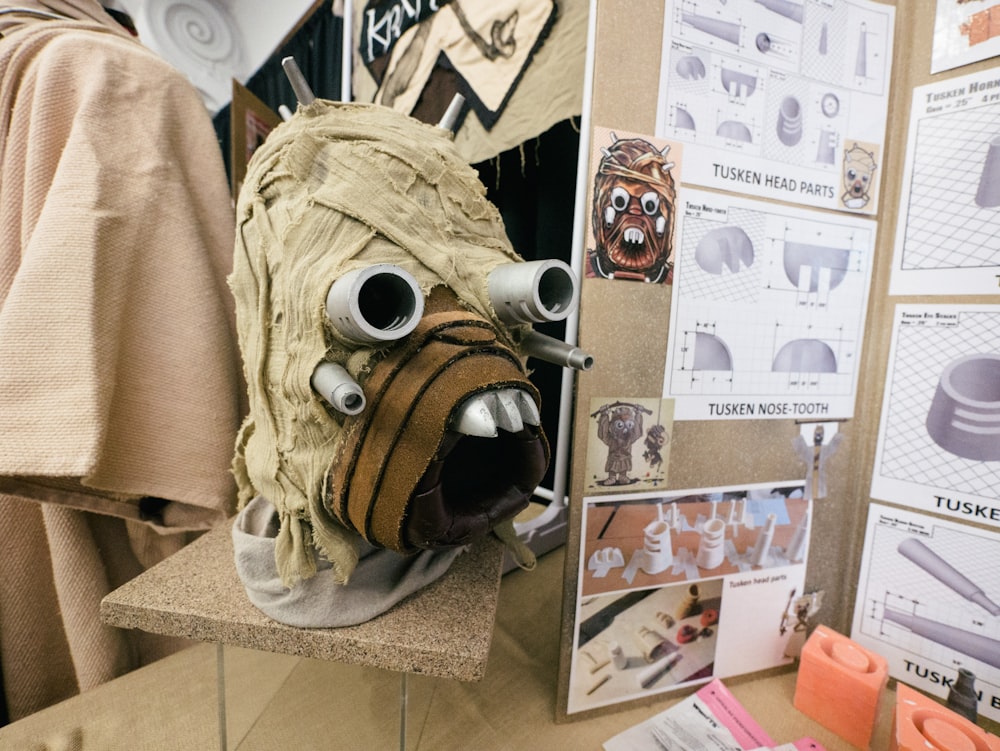 a close up of a mask on a table