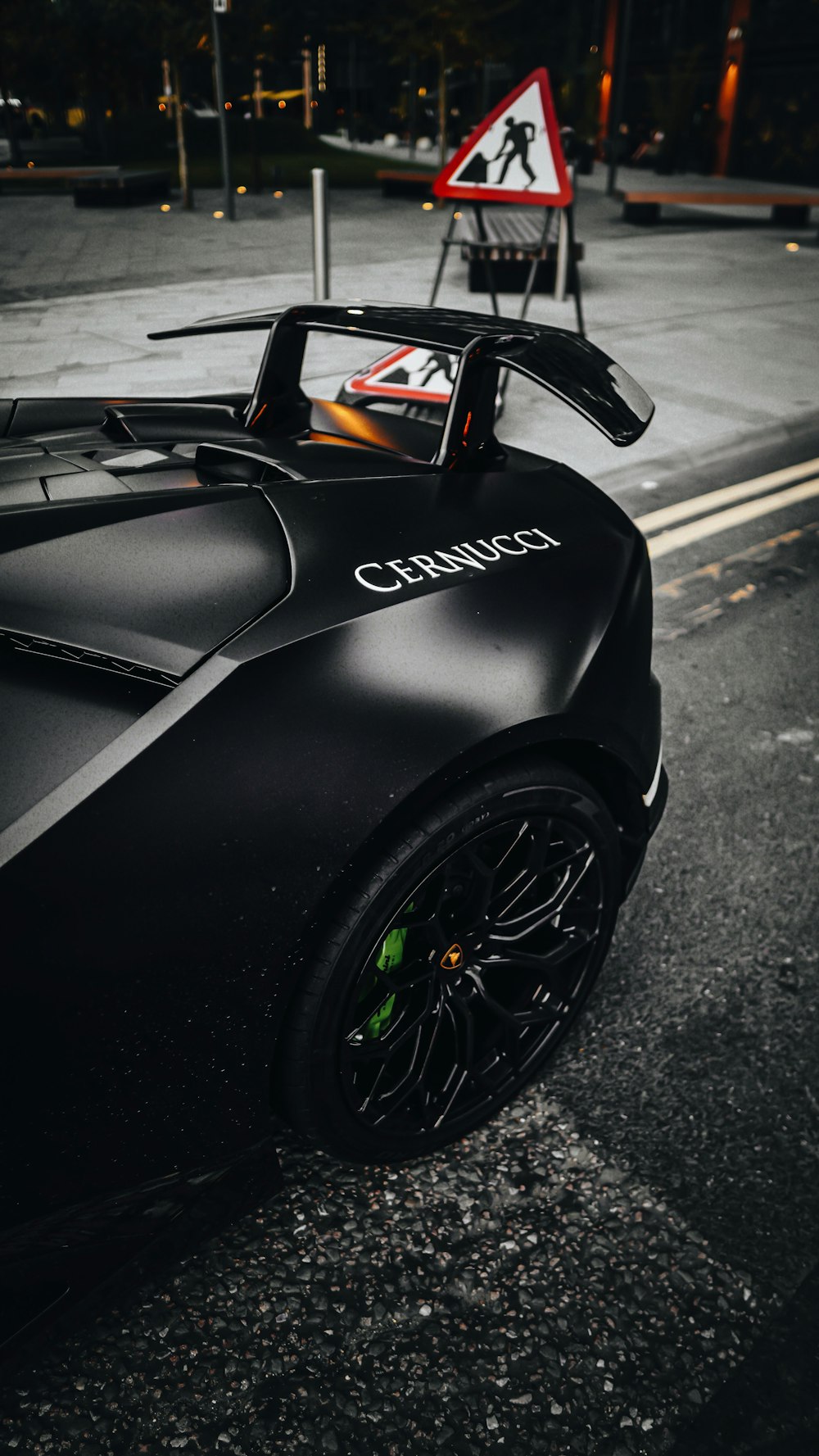 a black sports car parked on the side of the road