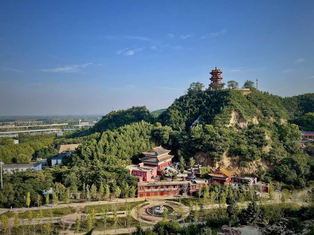 an aerial view of a building on a hill