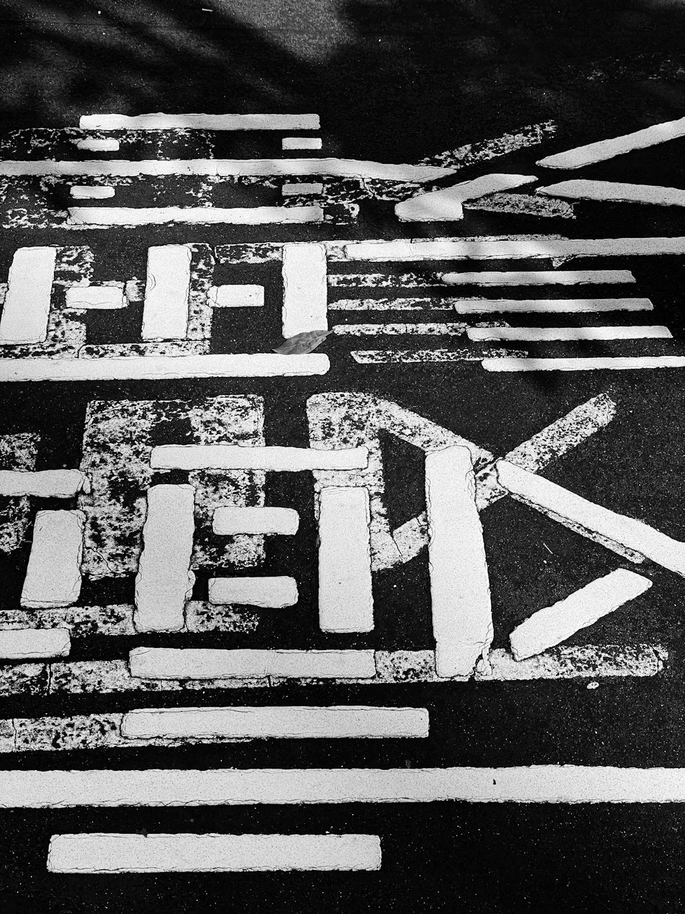 a black and white photo of a street sign