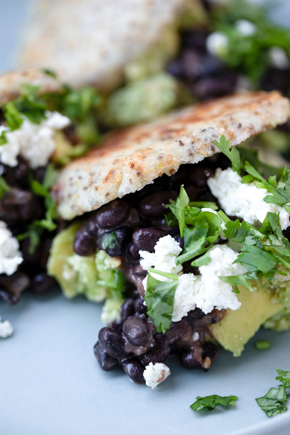 a close up of a plate of food with a sandwich