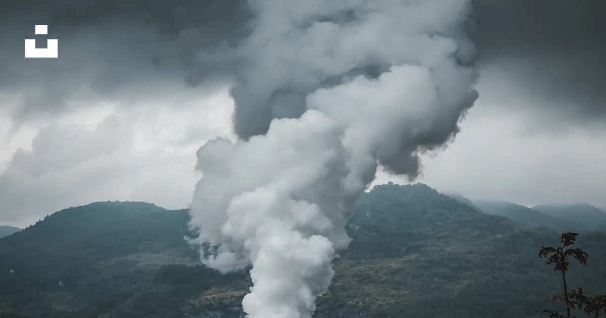 A red and white smokestack emits from a pipe photo – Free Cloud Image ...