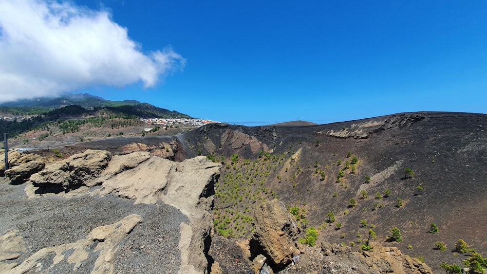 a scenic view of a mountain with a blue sky