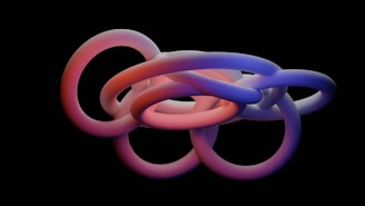 a group of intertwined rings on a black background