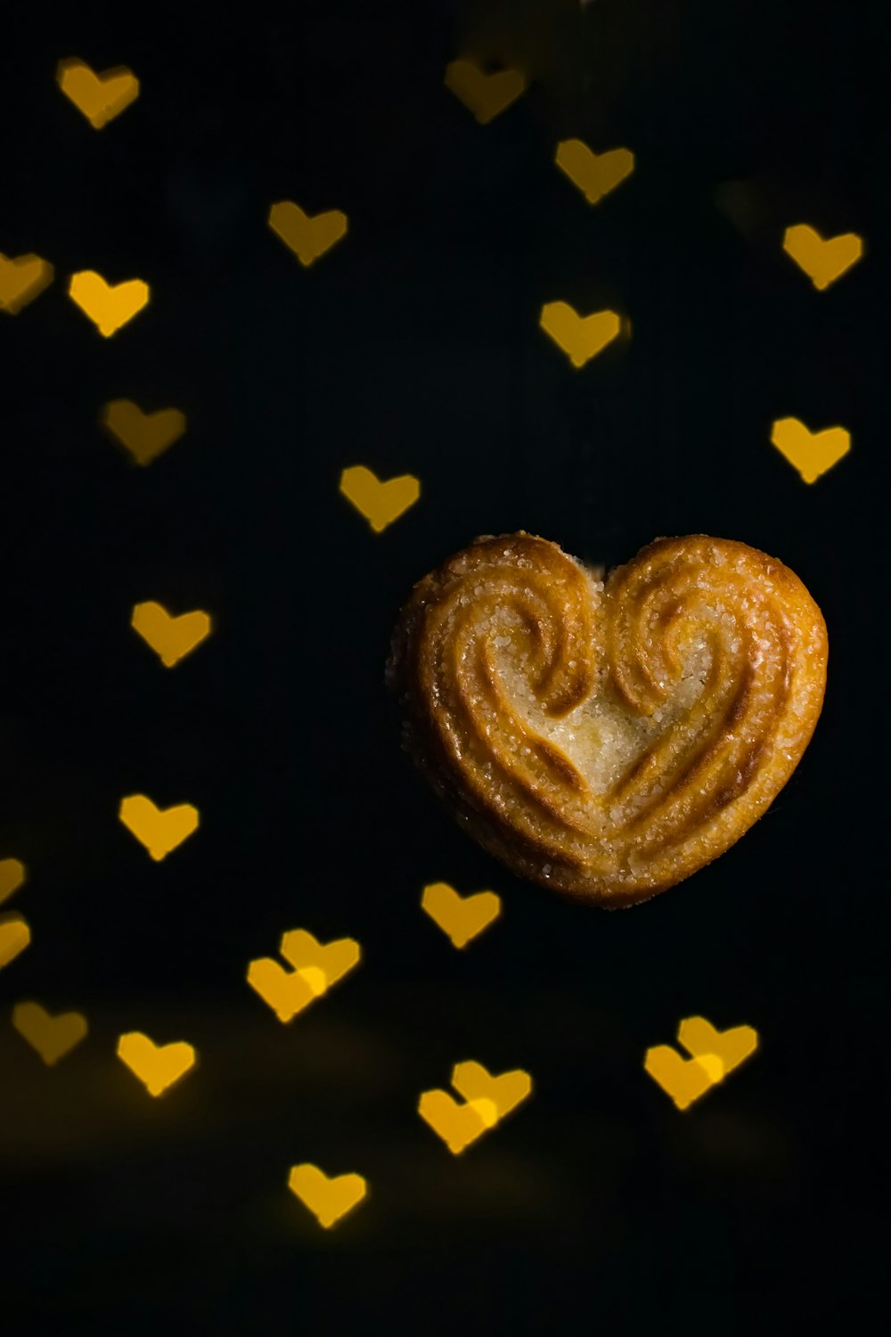 a heart shaped pastry sitting on top of a table