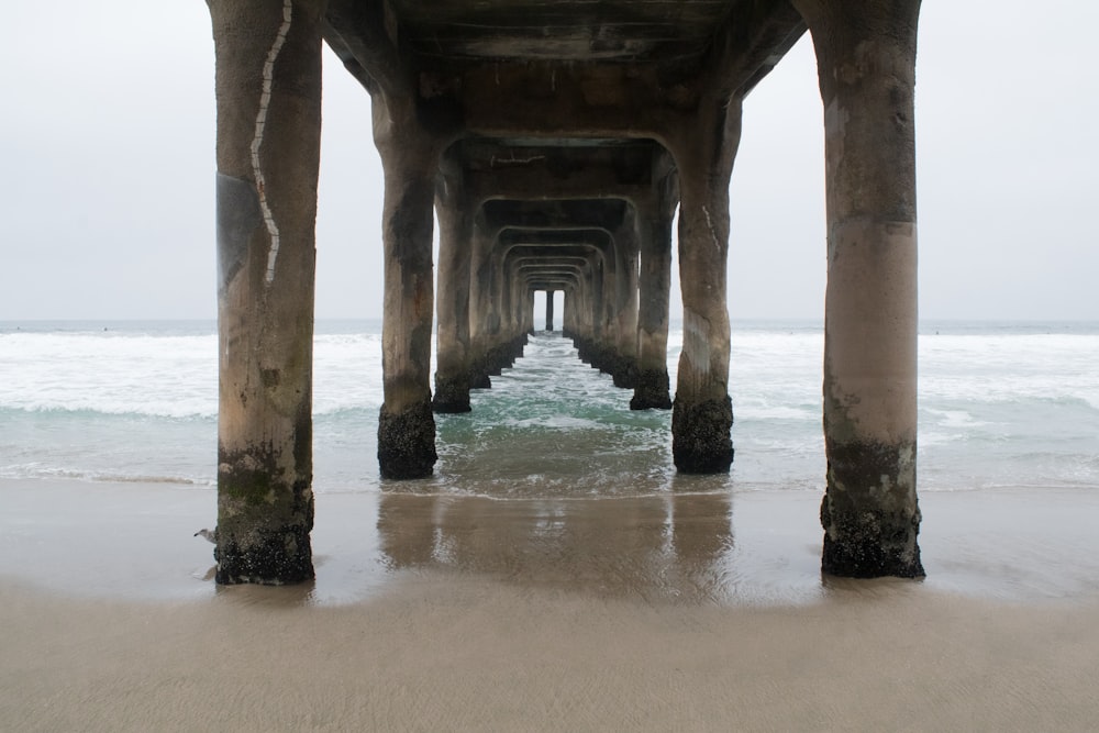 a view of a pier with the ocean in the background