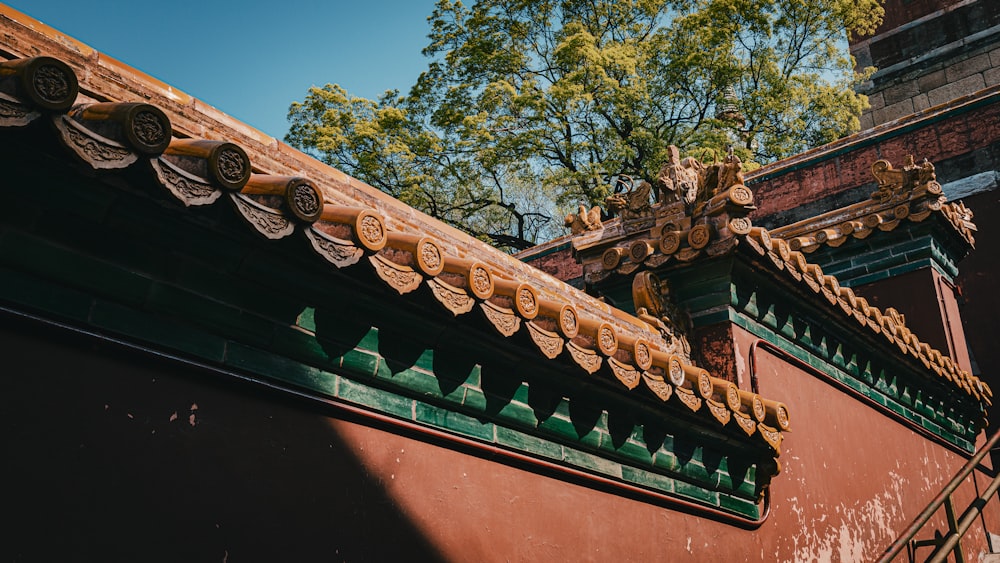 the roof of a building with a tree in the background