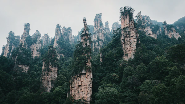 Bailong Elevator shaft against dramatic vertical sandstone cliff face