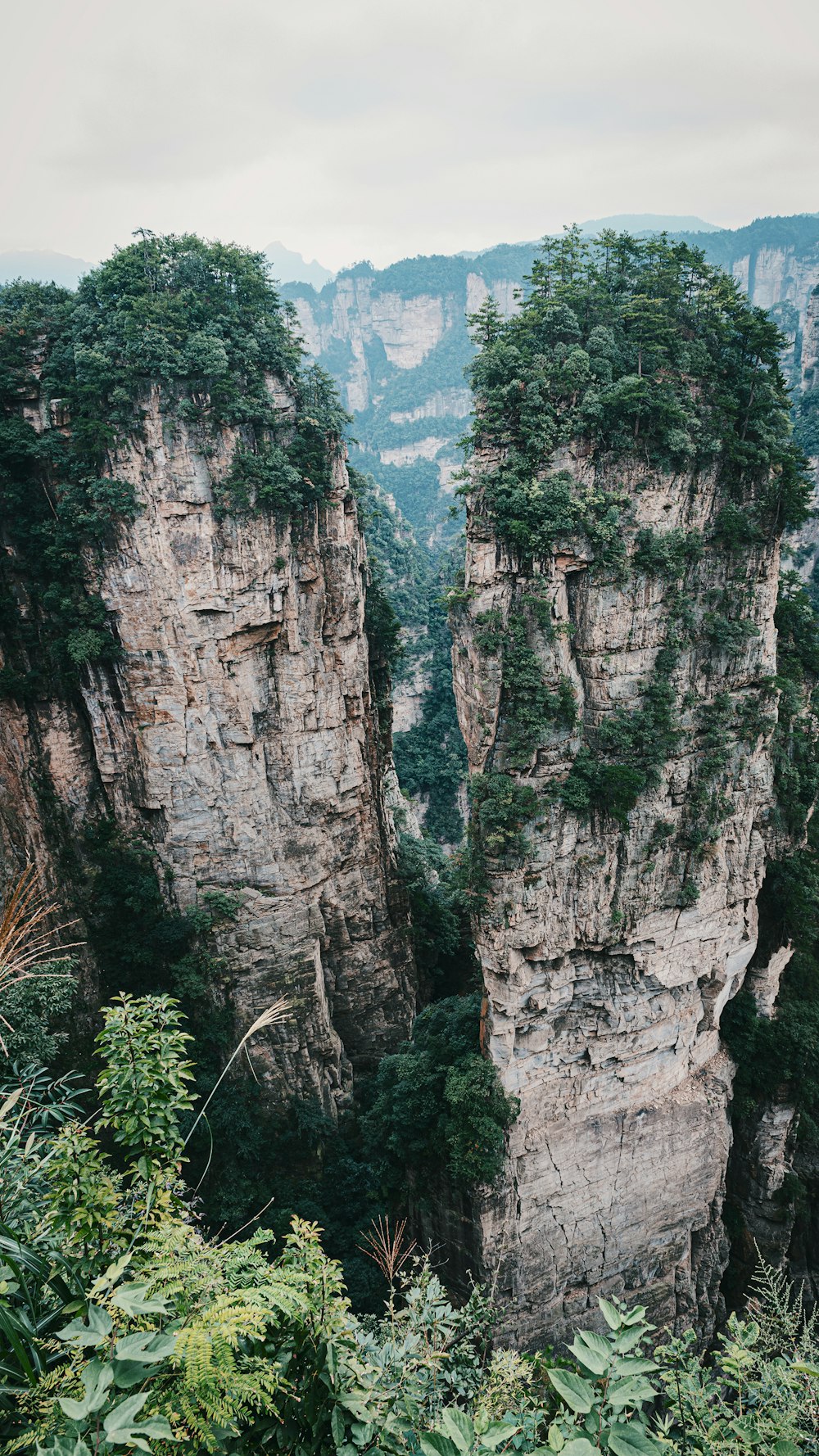 a couple of tall mountains sitting next to each other