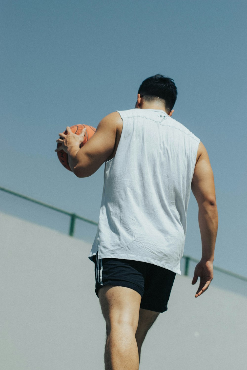 a man holding a frisbee in his right hand