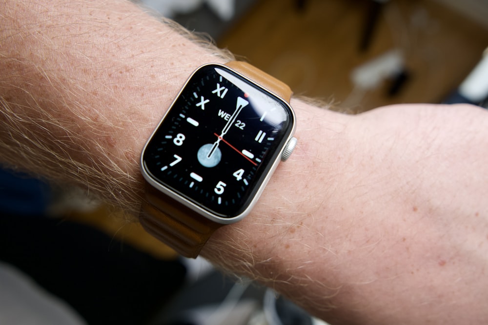 a close up of a person wearing a watch