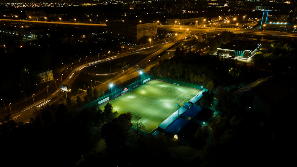 an aerial view of a tennis court at night