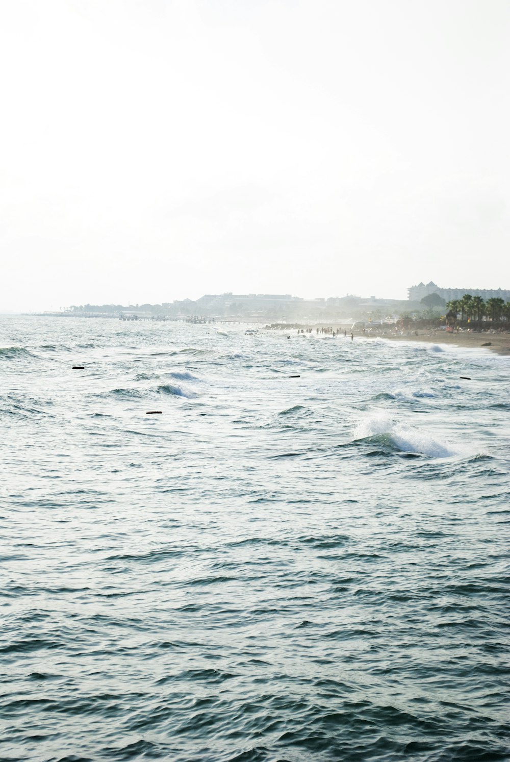 a body of water with waves coming in to shore