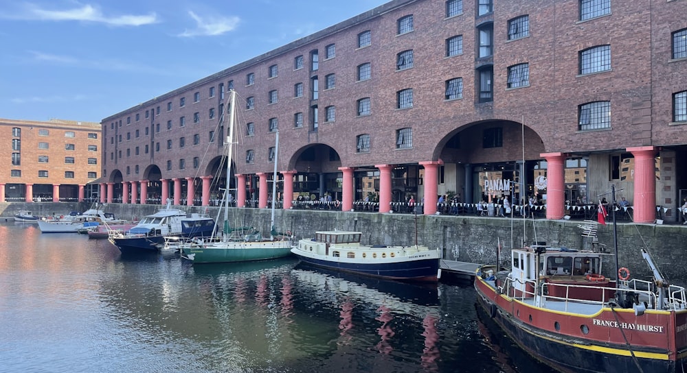 a group of boats that are sitting in the water