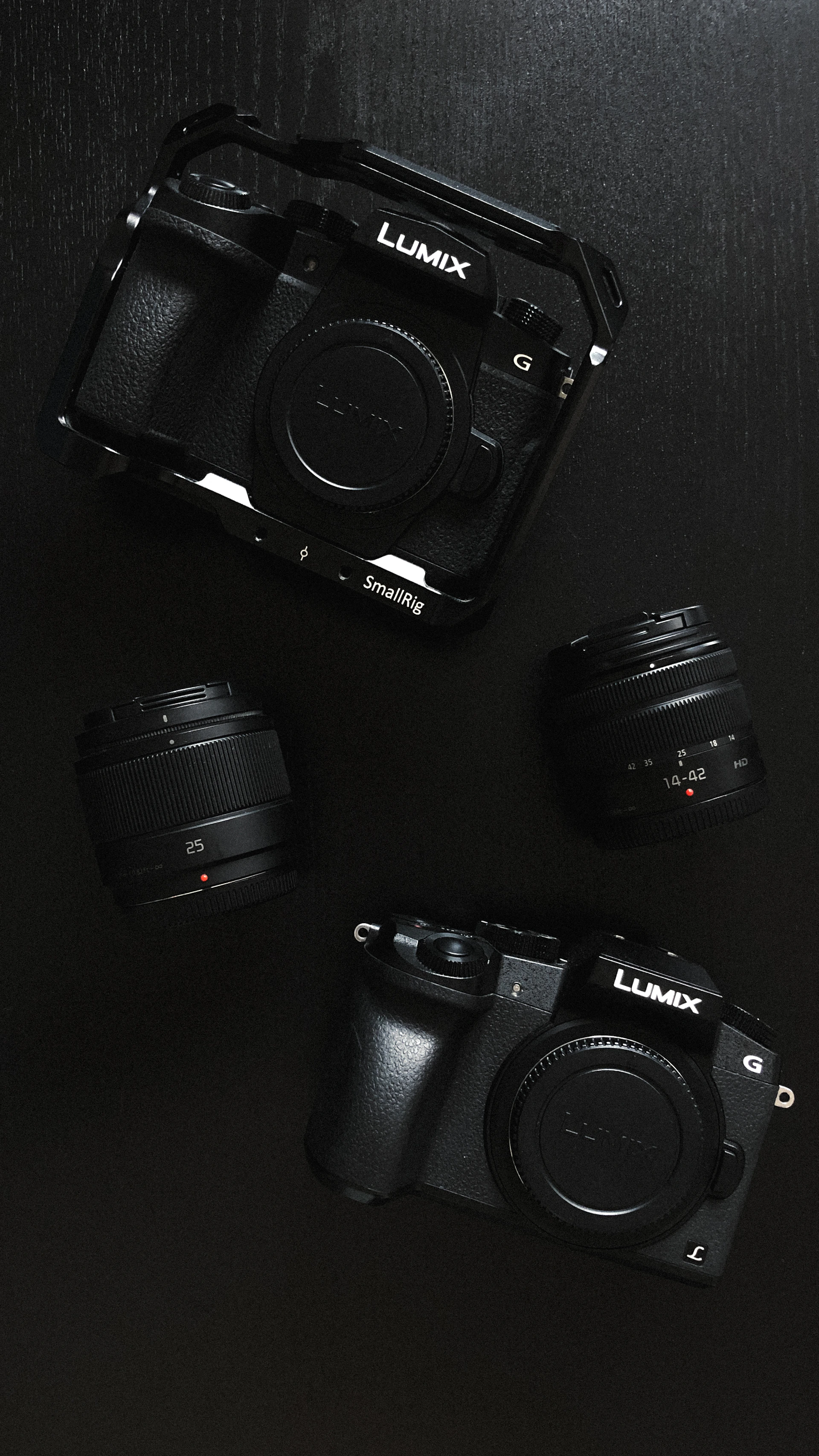 a camera and some other cameras on a table