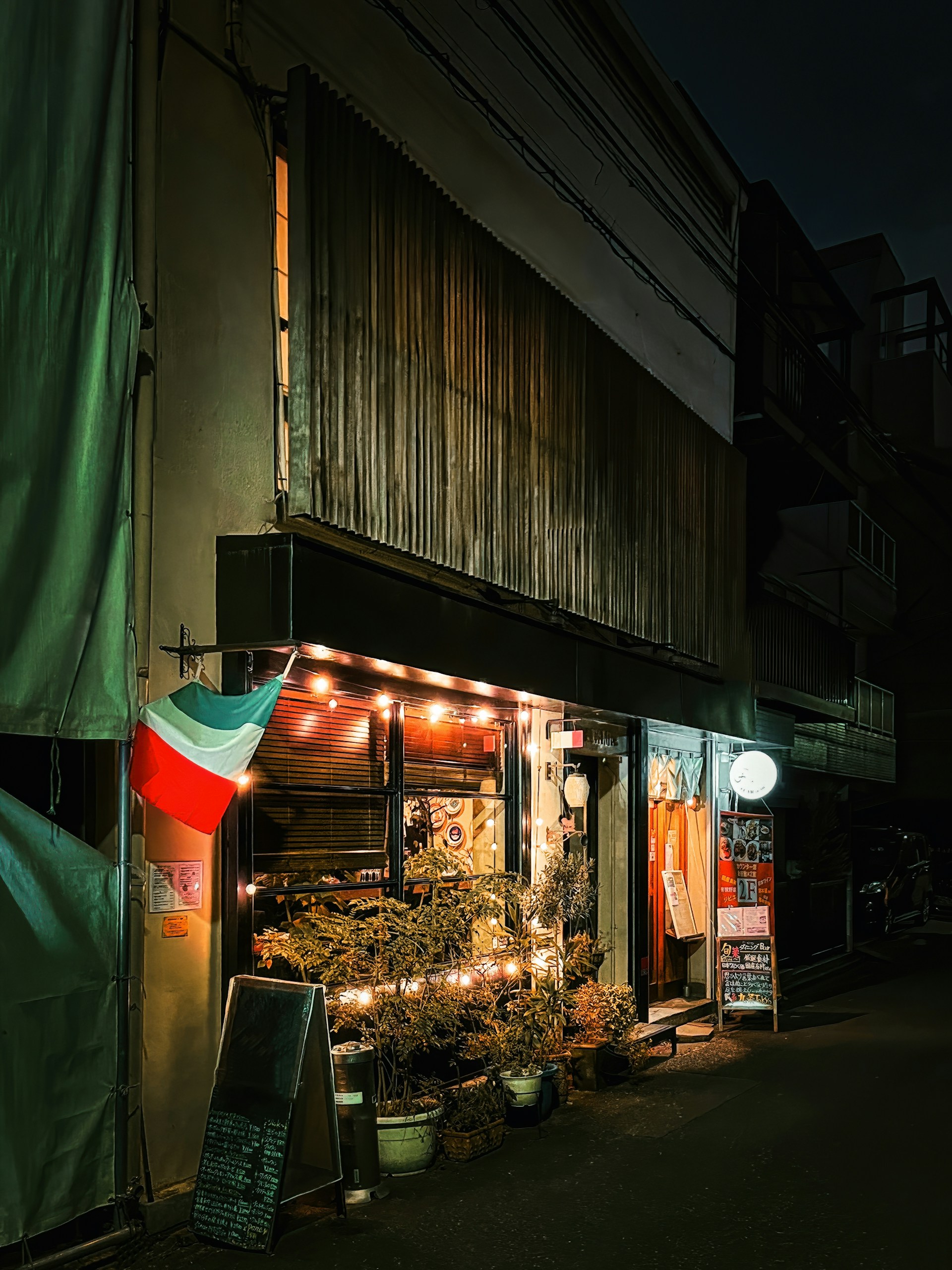 The warm, inviting interior of Positano restaurant featuring minimalist decor and Italian flag colors subtly integrated.