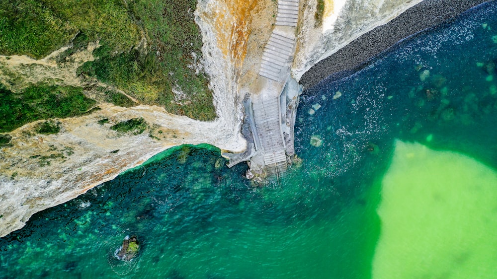 an aerial view of a bridge over a body of water