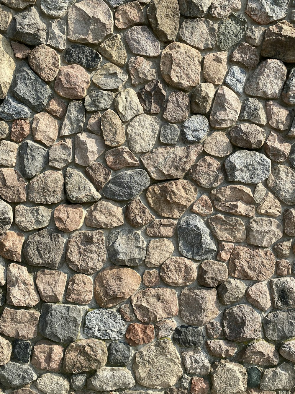 a stone wall made of rocks and gravel