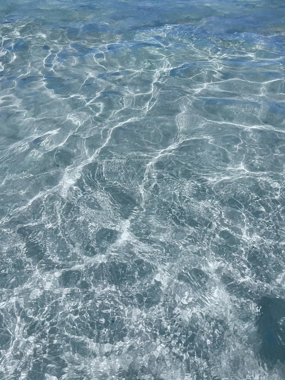 a person riding a surfboard on top of a body of water