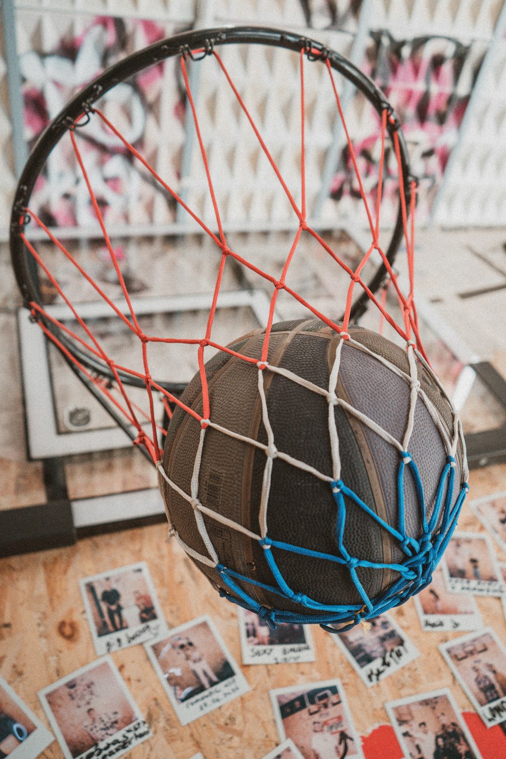a basketball inside of a net on the floor