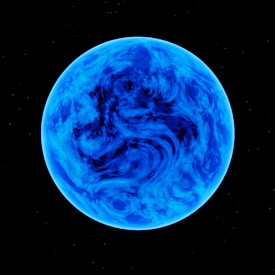 A blue planet with swirling cloud patterns against a black space backdrop. The planet's surface appears dynamic with varying shades of blue creating a marbled effect.