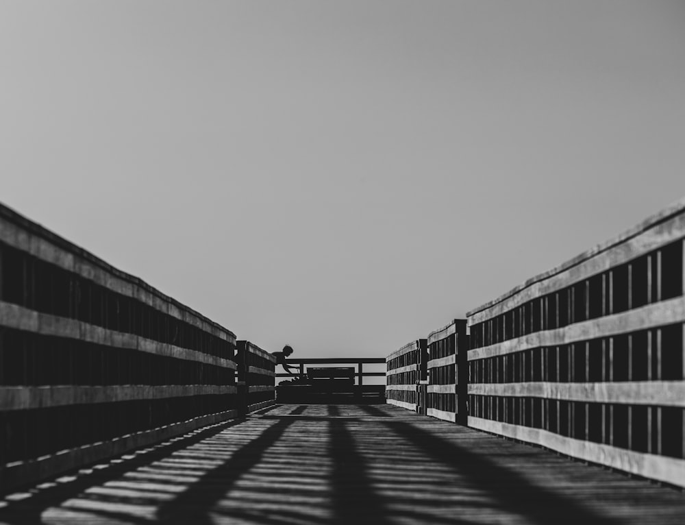 a black and white photo of a walkway