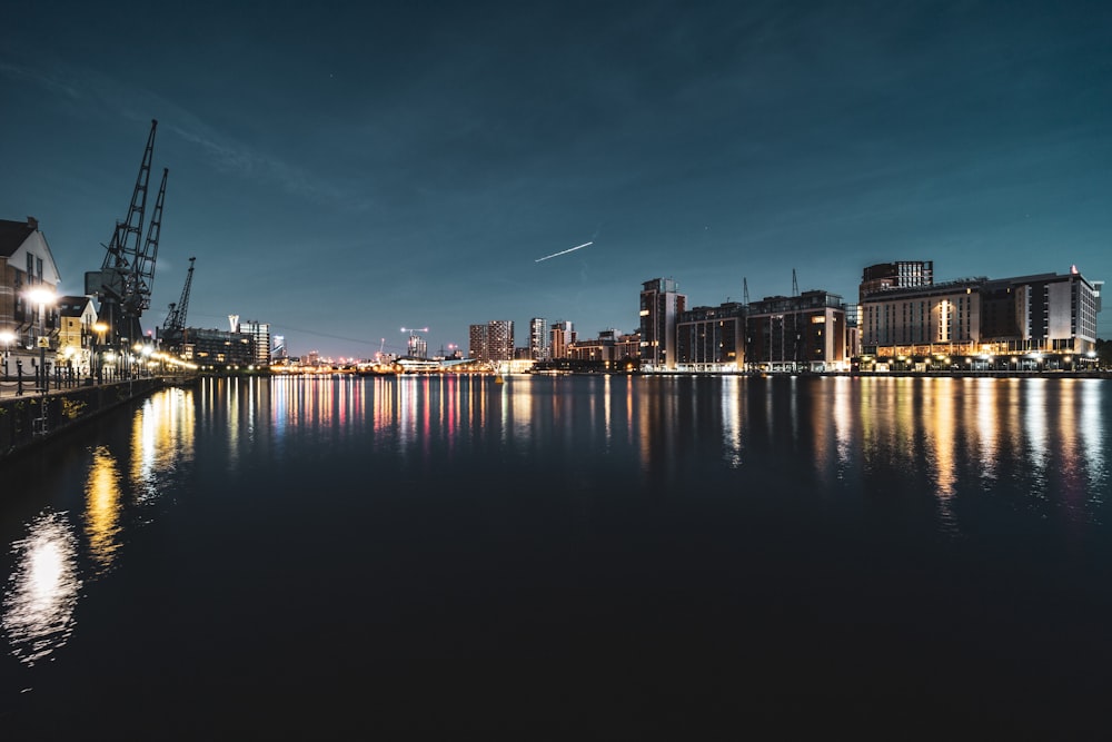 a large body of water with a city in the background