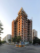 a tall building with a lot of windows and a lot of scaffolding on