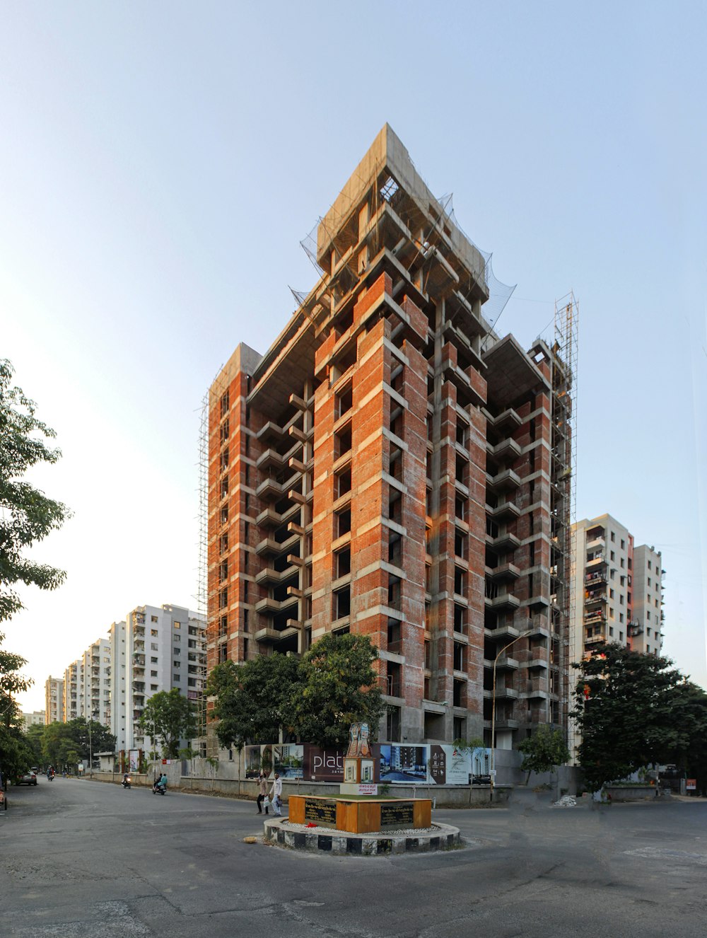 a tall building with a lot of windows and a lot of scaffolding on