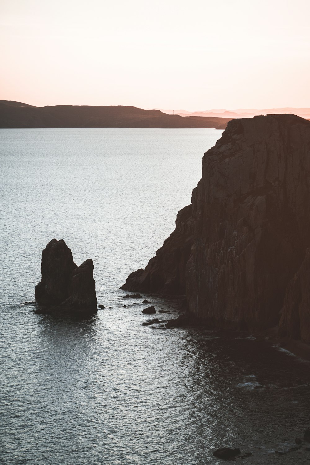 a large body of water surrounded by rocks