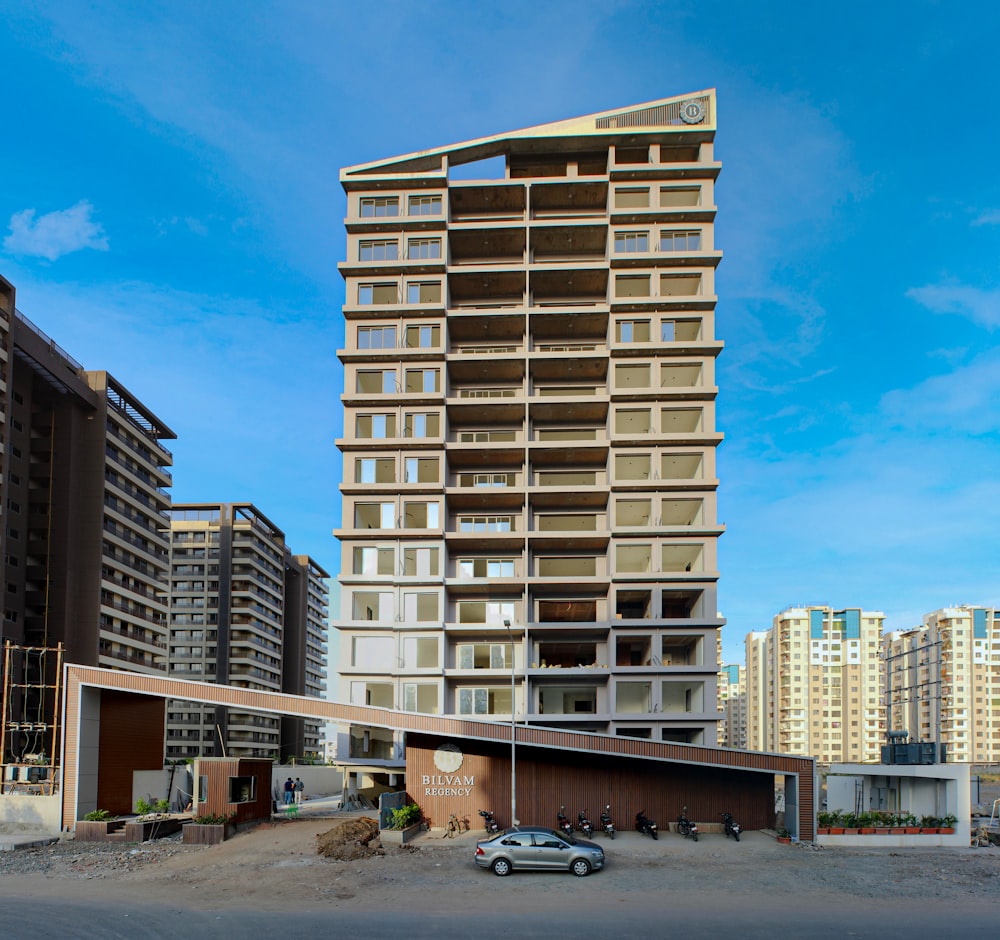 a car parked in front of a tall building