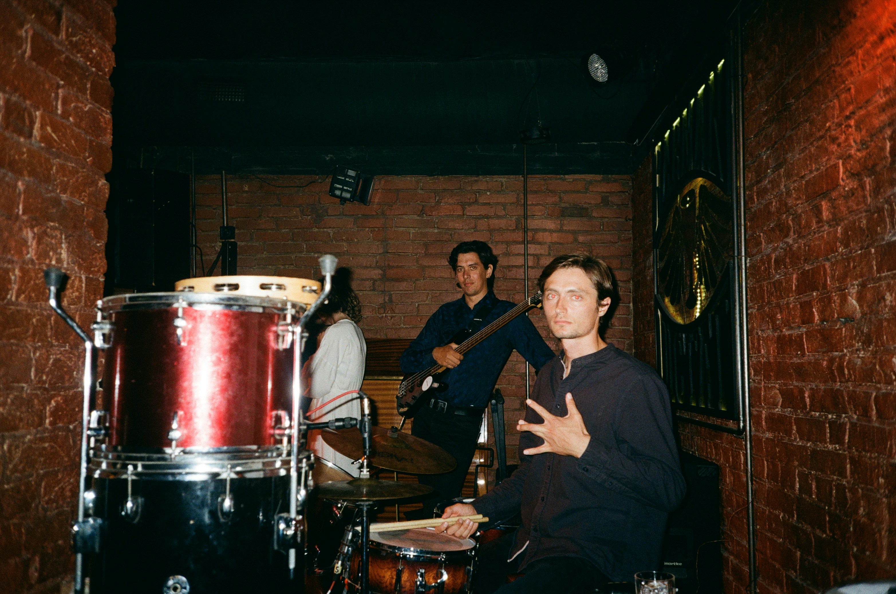 John C. Reilly as Dale Doback sitting behind his drum set with a proud look.